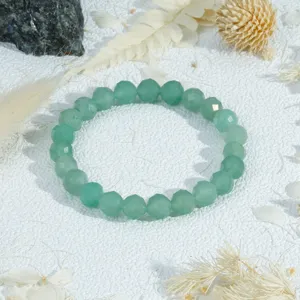 Green crystal faceted bead bracelet detail showing the delicate texture and polish.