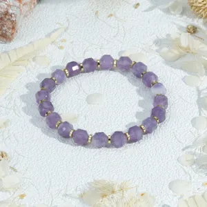 Elegant faceted purple stone beaded bracelet with gold spacers, stylish minimalist wrist jewelry.
