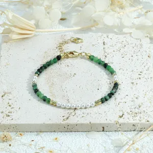 Handmade green beaded and pearl spliced bracelet detail view, elegant stackable jewelry.