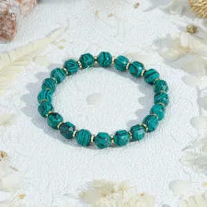 Vintage style green speckled stone beaded bracelet with golden spacers for daily wear