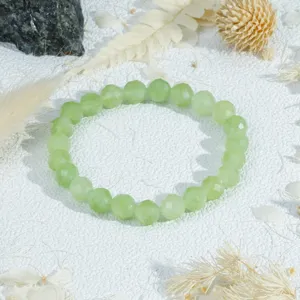 Faceted light green crystal bead bracelet detail view, elegant stackable design natural stone.