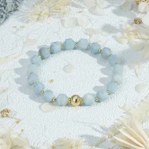 Faceted light blue gemstone bracelet with gold accent beads for delicate everyday style.