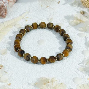 Close-up detail of faceted gemstone beaded bracelet with gold spacers, chic style.