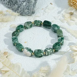 Green irregular block gemstone bracelet detail shot, elegant minimalist design with gold spacers.