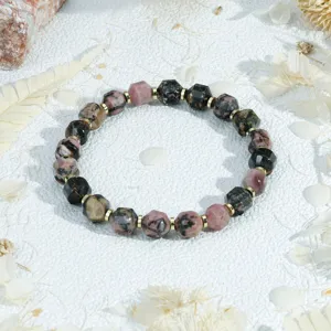 Detailed close-up of retro faceted speckled stone bracelet with golden spacers for daily stacking style.