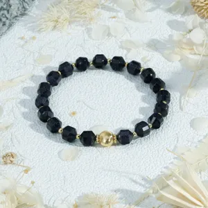 Vintage faceted gemstone beaded bracelet with golden metal ball detail for versatile daily wear.