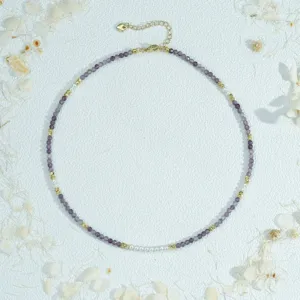 Handcrafted purple beaded necklace with faux pearls and gold details, elegant choker jewelry.
