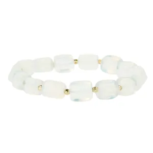 Detail view of irregular white block bead bracelet with gold spacer beads, minimalist style.