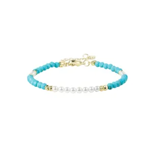 Turquoise and pearl beaded bracelet with gold spacers and adjustable chain for daily wear.