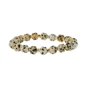 Detailed shot of vintage dalmatian stone faceted bead bracelet with golden metal spacers.