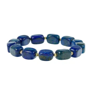 Close-up detail of natural lapis lazuli square bead bracelet with shiny gold accent beads.