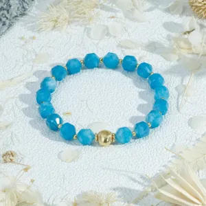 Detailed close-up of blue faceted beaded bracelet with gold accents for elegant daily wear.