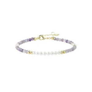 Elegant purple gemstone and pearl beaded bracelet with gold accents and secure lobster clasp.