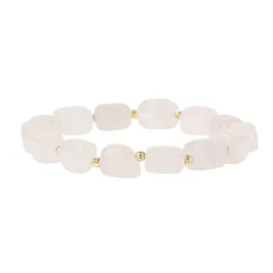 Close-up detail of irregular pink stone block bracelet with gold metal spacer beads.
