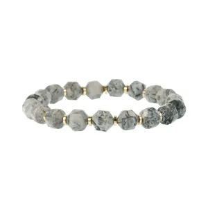 Detailed close-up of faceted grey patterned stone beads bracelet with gold-tone metal spacers.