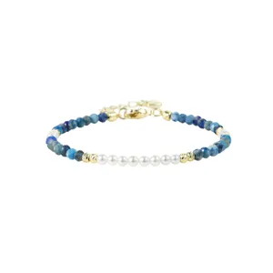 Delicate handmade beaded bracelet with blue stone and white pearl splicing, gold details.