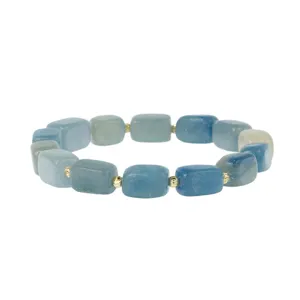 Close-up of blue geometric stone beads bracelet featuring dainty metallic golden spacer accents.