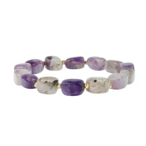 Detailed shot of an irregular purple and white gemstone bracelet with small gold accent beads.