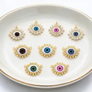 Evil eye charms detail closeup showing micro pave cubic zirconia and colorful resin eye pendants.