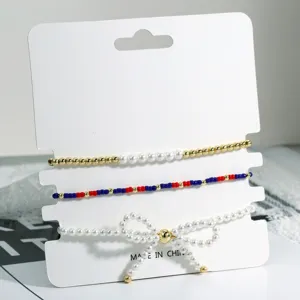 Drei-teiliges gestapeltes Perlen Schleifen Perlen Armband Set, schickes Retro Farbdesign.