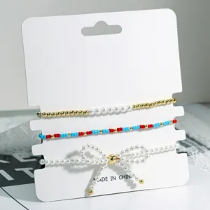 Mehrlagiges Perlen Schleife Perlenarmband Set, zartes schickes Design, trendiger Schmuck.