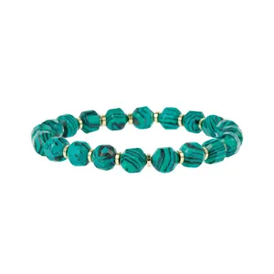 Detailed shot of faceted green gemstone beads bracelet with gold spacers, exquisite jewelry item.