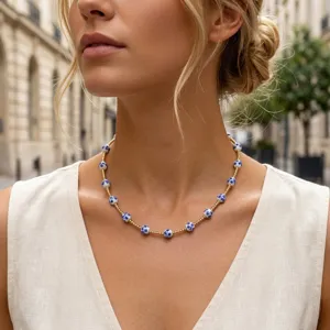 Exquisite Chinese style blue and white porcelain bead necklace with delicate gold chain detail.