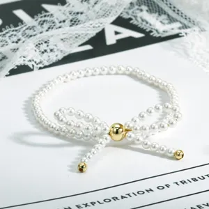 Elegantes Perlen Schleifen Armband mit Goldperlen, süßer Vintage Armschmuck für Damen Stil.