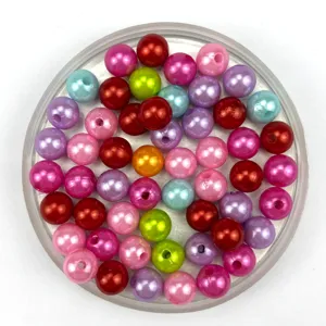 Colorful ABS imitation pearl loose round beads for DIY handmade jewelry crafting and bracelet making.