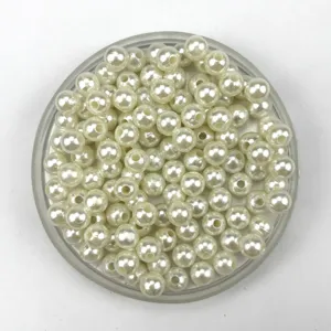 Close-up detail of smooth white ABS plastic imitation pearls, perfect for DIY jewelry and crafts.