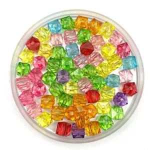 Detailed view of colorful transparent faceted acrylic square beads for DIY jewelry making crafts.