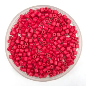 Close up of red acrylic barrel beads, ideal for DIY jewelry making and bracelet accessories.