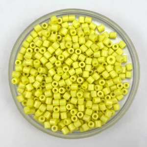 Yellow plastic barrel beads detail close up, 4mm acrylic DIY bracelet necklace jewelry components.