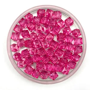 Close-up detail of translucent pink acrylic square beads for DIY beading and craft projects.