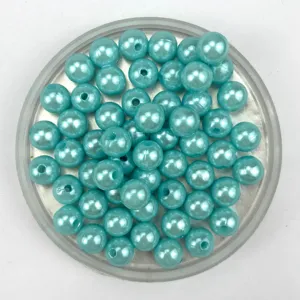 Light blue imitation pearl beads detail shot, showing pearlescent shine for DIY jewelry crafts.
