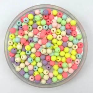 Colorful macaron plastic round beads detail view, perfect for DIY jewelry and children crafts.