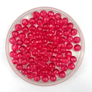 Detailed view of pink faceted acrylic globe beads, perfect for DIY jewelry and crafts.
