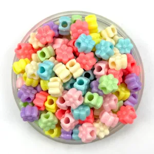Colorful plastic flower beads with large holes, pastel spring colors for DIY jewelry crafting.