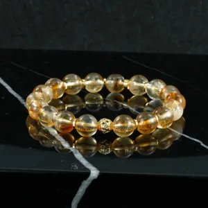 Elegante brazalete de cuentas de piedra preciosa natural con espaciadores dorados para mujer.