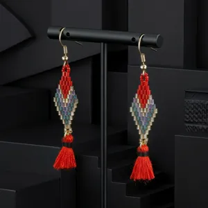 Handmade bohemian beaded tassel earrings featuring color-blocked geometric diamond designs.