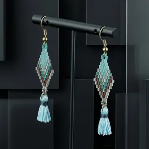 Handmade boho seed bead tassel earrings with geometric diamond shape for women vacation style.