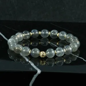 Pulsera de cuentas de labradorita natural con separadores dorados y abalorio hueco de oro.
