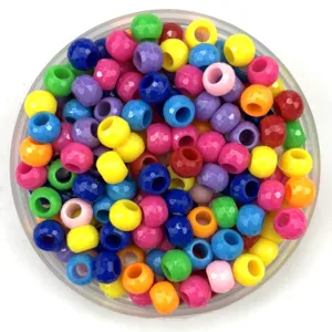 Detail view of colorful faceted plastic pony beads for DIY crafts and jewelry making accessories