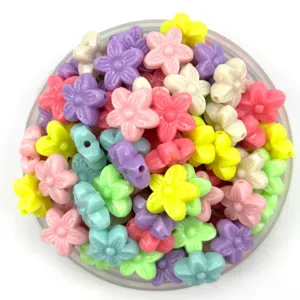 Acrylic flower beads detail shot, colorful mini floral charms for DIY bracelets phone chains.