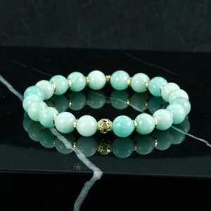 Pulsera de cuentas de piedra natural con espaciadores dorados y abalorio central para joyeria