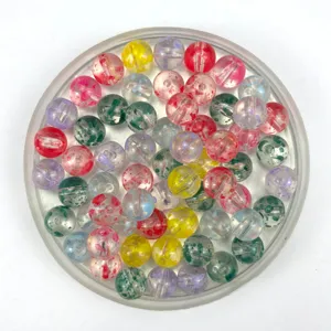 Detailed view of colorful speckled acrylic beads for DIY jewelry making and craft projects.