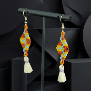 Handmade colorful beaded tassel earrings featuring a bohemian geometric rhombus design style.