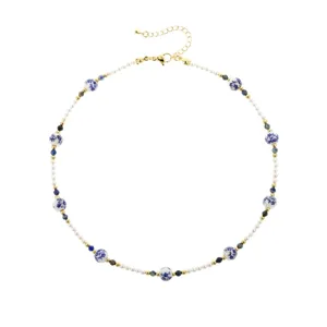Detail view of the new Chinese blue and white porcelain shell pearl necklace, featuring fine beads.