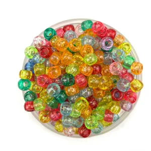 Colorful transparent acrylic barrel beads, close-up view of loose DIY beading accessories.