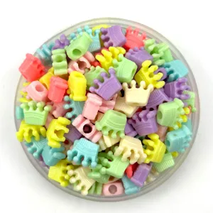 Colorful plastic crown beads detail shot, ideal for DIY children handmade crafts and bracelets.